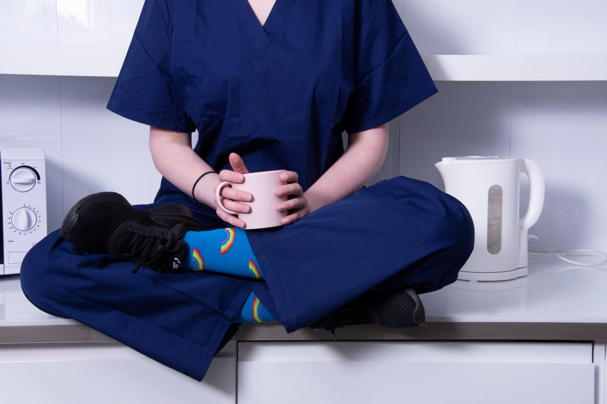 fitlegs compression socks for every day life - rainbow pattern worn on nhs nurse