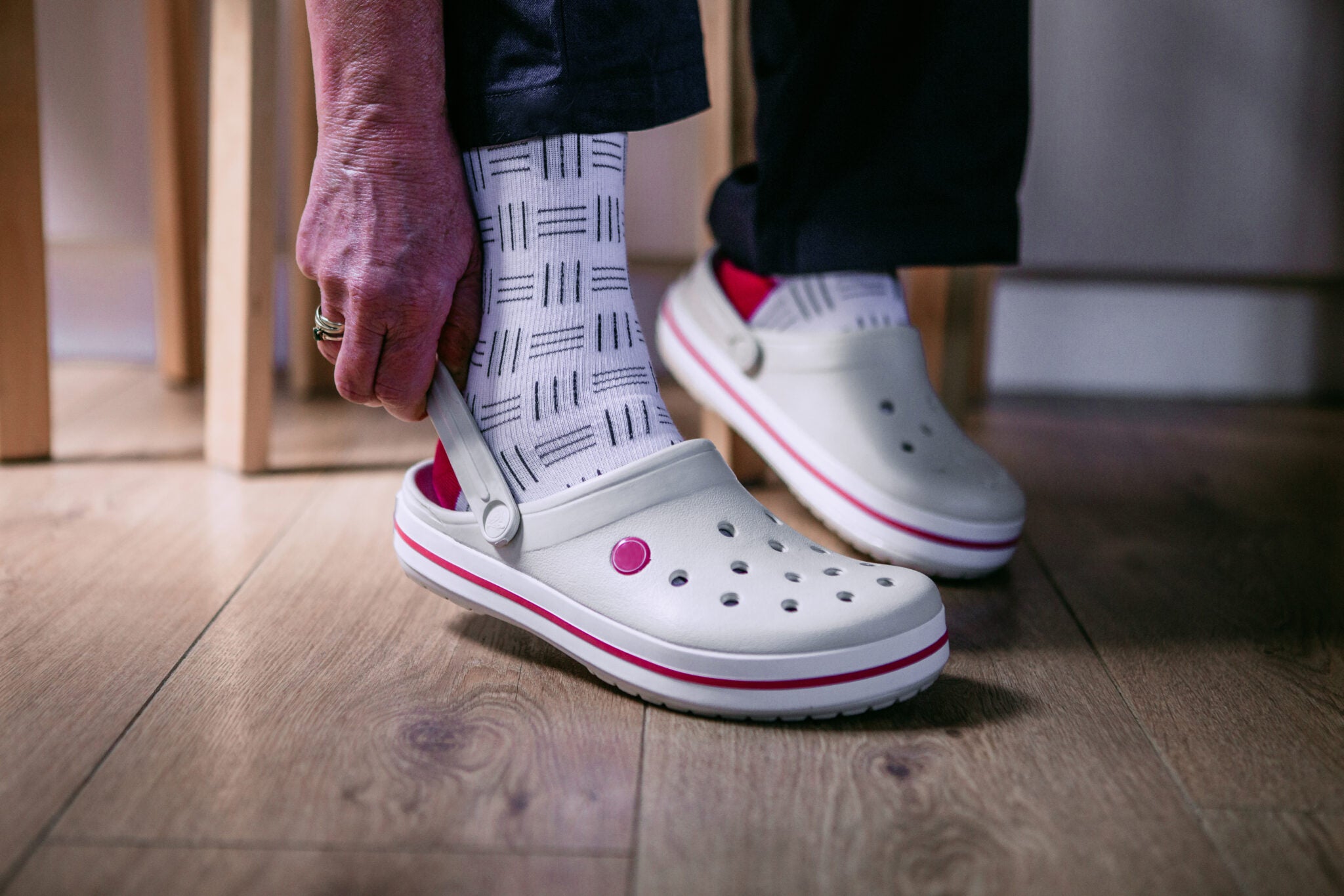 fitlegs every day life compression socks - knee high - pink and white - lifestyle shot in crocs