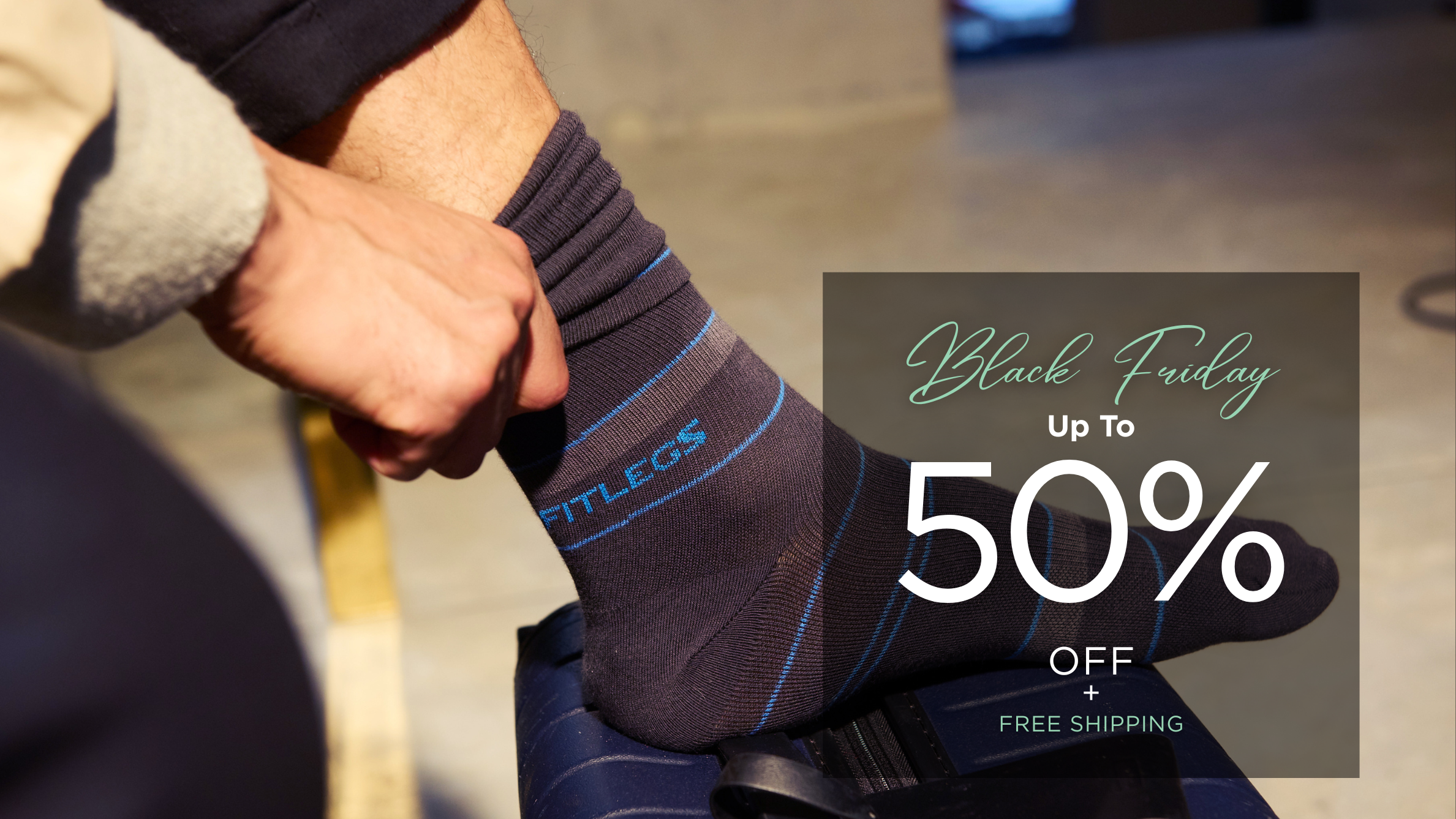 Banner promoting the FITLEGS Compression Socks Black Friday Sale with discounted pricing highlighted with stripe socks. 