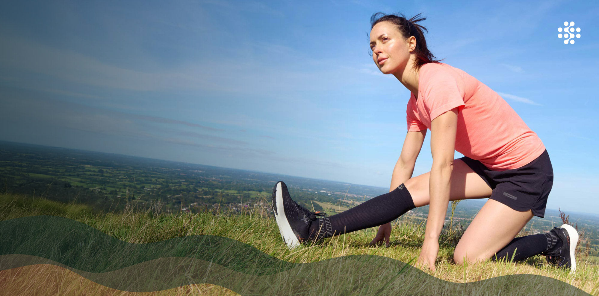 Sports compression socks - athlete runner stretching in black knee length compression socks